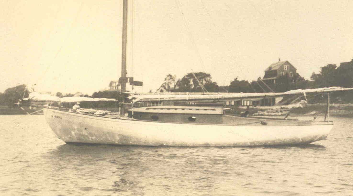 Sepia image of boat Sheer Kahn with furled sail