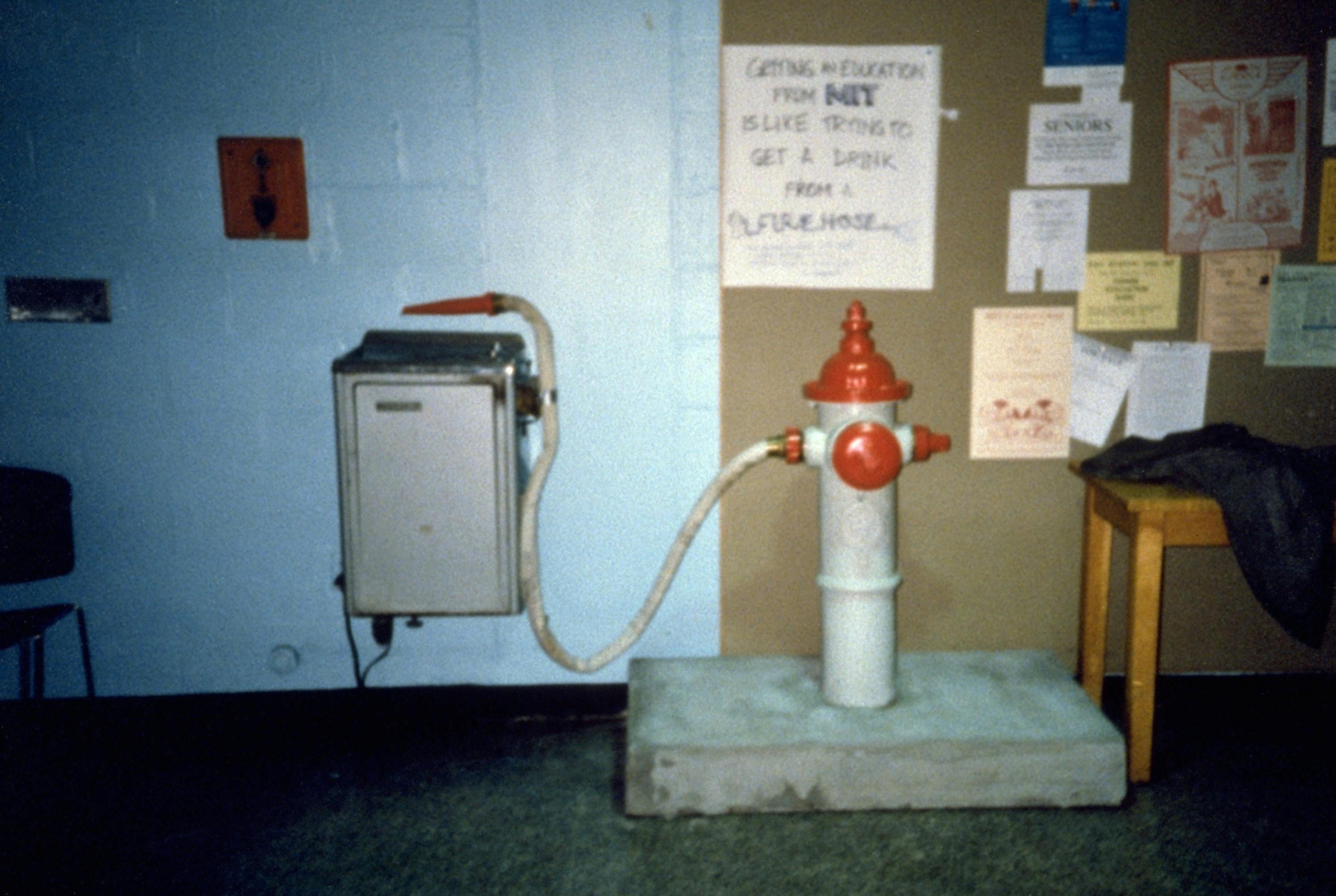 water fountain hooked to fire hydrant to show what an MIT education is like