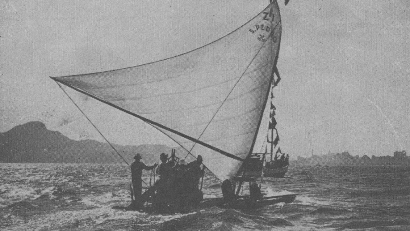 B&W archival magazine image of men sailing a jangada.